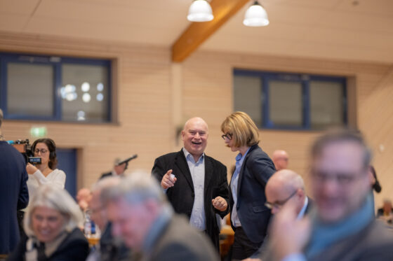 People chat at the event