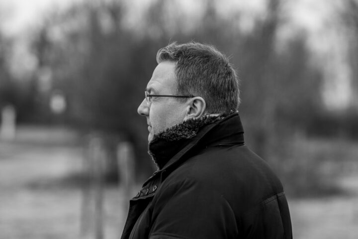 Profile view of a man outdoors
