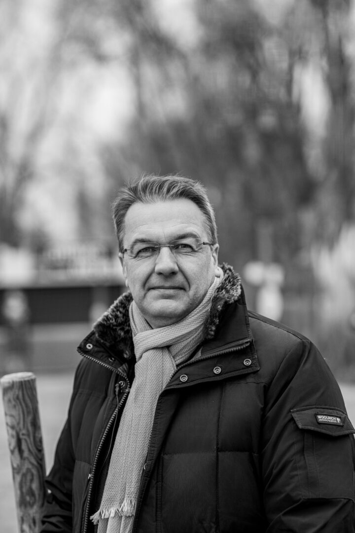 Man with scarf in black and white photograph