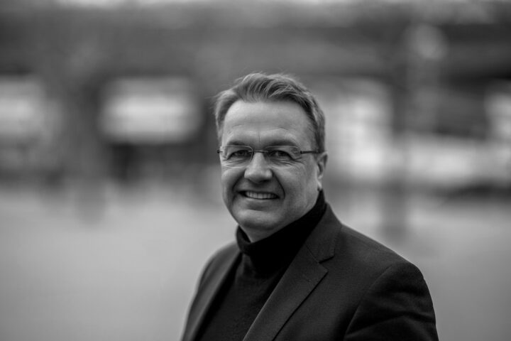 Smiling man in black and white portrait